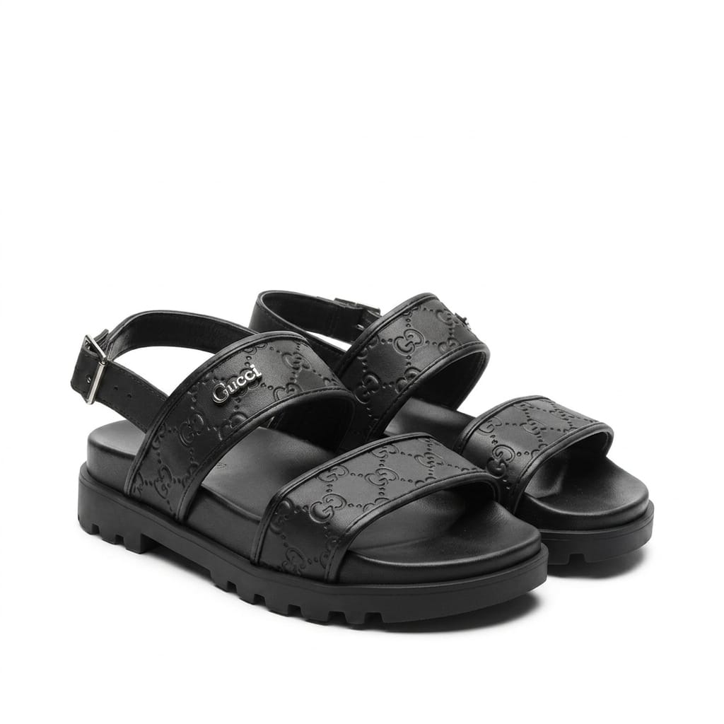 Gucci GG Embossed Leather Platform Sandals.